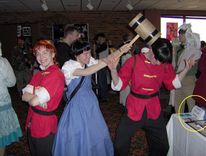 The sign reads "Cosplay First-Aid Station". I think they took the sign to literally.